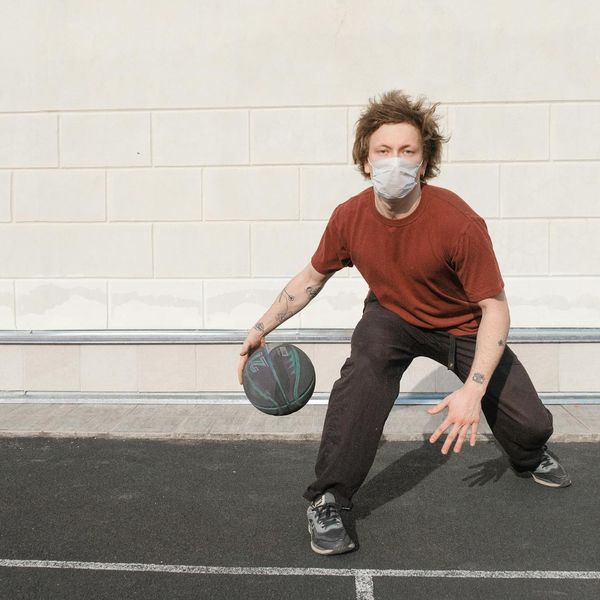Person in a state of calm focus during a light exercise.